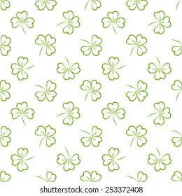 Repeating vector green clovers pattern 