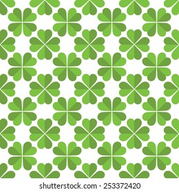 Repeating vector green clovers pattern 