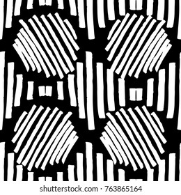 A repetitive abstract geometric black and white pattern drawn by a brush.