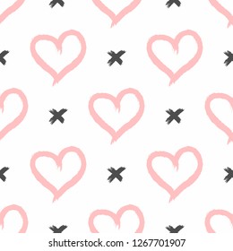 Repetitive hearts and crosses drawn by hand with a rough brush. Cute seamless pattern. Sketch, graffiti, grunge, paint. Stylish print for girls. Simple vector illustration. White, pink, black.