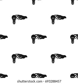 Replacement of an electric bulb. Incandescent lamp single icon in black style vector symbol stock illustration web.