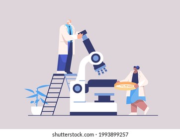 research scientist team working with microscope researchers making chemical experiment in laboratory