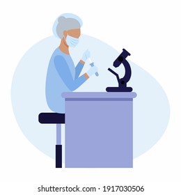 A researcher makes a study under a microscope. A laboratory assistant makes tests in the laboratory. Development of the covid 19 coronavirus vaccine