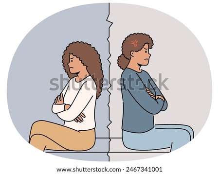 Resentment between African American mother and teenage girl sitting back to back after quarrel. Daughter offended by mom because of quarrel and excessive punishment for poor school performance