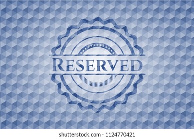 Reserved blue emblem with geometric pattern.