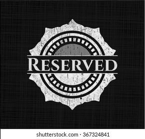 Reserved chalkboard emblem written on a blackboard