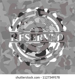 Reserved on grey camouflaged texture