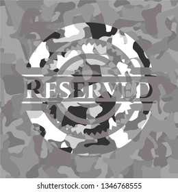 Reserved written on a grey camouflage texture