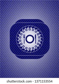 restaurant icon inside badge with denim texture