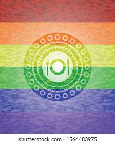 restaurant icon inside emblem on mosaic background with the colors of the LGBT flag