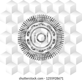 restaurant icon inside grey badge with geometric cube white background