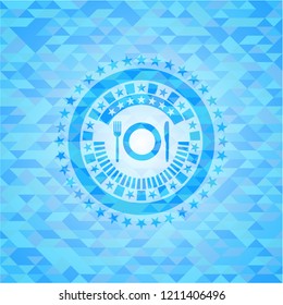 restaurant icon inside light blue emblem with mosaic background