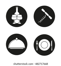 Restaurant items icons set. Wine bottle and glasses, corkscrew, covered dish, fork, plate and table knife. Eatery symbol. Vector white silhouettes illustrations in black circles