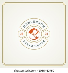 Restaurant logo template vector illustration. Waiter hand holding tray silhouette, good for restaurant menu and cafe badge. Vintage typography emblem design.