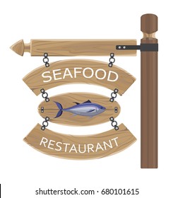 Restaurant seafood advertisement with fish on wooden board attached by chain to horizontal notice and long standing stick vector poster