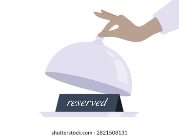 Restaurant table booking system, a waiters hand lifting a cloche, revealing a reserved sign on a tray