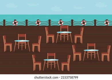 restaurant terrace with wooden deck chairs and tables near the sea in summer