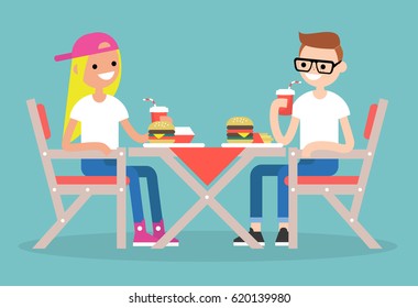 Restaurant visitors. Two teenagers having dinner in a fast food restaurant / flat editable vector illustration, clip art