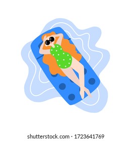 Resting girl in a red retro polka dot swimsuit. A woman enjoys the bright sun on a comfortable air mattress. Have a great time on vacation