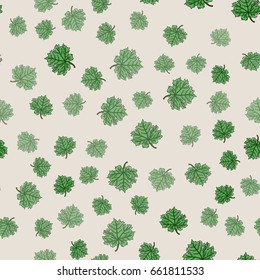 Restrained seamless floral pattern. Green leaves of maple on beige background can be used for design of textile, print, wrapping paper or computer wallpaper. Spring, summer or autumn backdrop