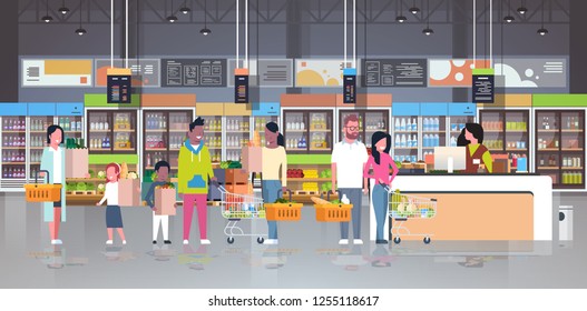 Retail Woman Cashier At Checkout Supermarket Mix Race Customers Holding Basket With Food Standing Line Queue Shopping Concept Grocery Market Interior Flat Horizontal