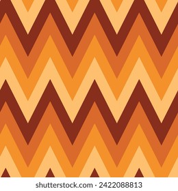 Retro 70s chevron seamless pattern in orange, mustard yellow ,brown and cream. For backgrounds, textile, wallpaper and wrapping paper 