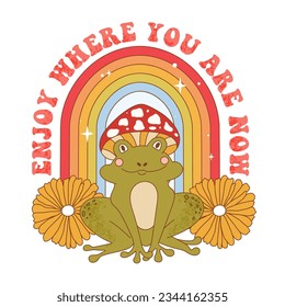 Retro 70s groovy funky frog with mushroom, flowers and rainbow. Enjoy where you are now slogan print with frog character wearing mushroom hat. Naive groovy psychedelic vintage illustration. 