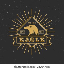 Retro badge logo eagle design with retro sunburst and ribbon for tag, logotype, emblem, banner, Insignia, T-shirt Screen, Stamp. Vector illustration.