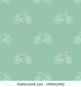 Retro bike seamless pattern on green background