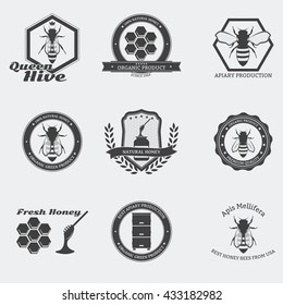 Retro black bee emblems with worker bees and queen in circle.