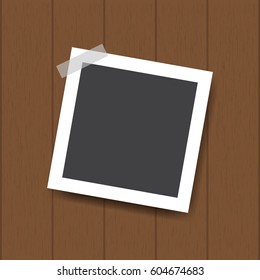 Retro blank photography with shadow on a wood background