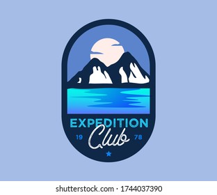 Retro blue colored mountain badge with sunset. Vector vintage styled outdoor wilderness badge