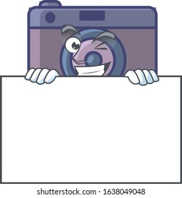 Retro camera cartoon character with funny face hides behind a board