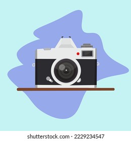 Retro camera in a flat style. Old camera illustrator. Miroless camera Vector