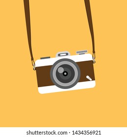 Retro camera in a flat style on a colored background. Old camera with strap.