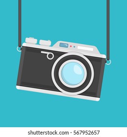 Retro camera in flat style on a colored background. Old camera with strap. Flat design vector illustration. Vintage Camera image. EPS 10.