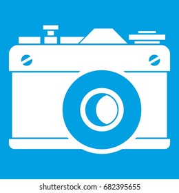 Retro camera icon white isolated on blue background vector illustration