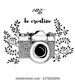 Retro camera with leaves decor. Sketch hand drawn illustration vintage style. Black and white. Inscription: be creative