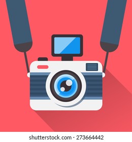 Retro camera on a strap in a flat style. Camera image on a red background shading with a shadow. Fully editable vector illustration.