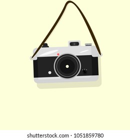 retro camera on a yellow background, belt, black insert