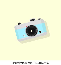 retro camera on a yellow background, with blue insert, 