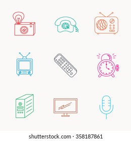 Retro camera, radio and phone call icons. Monitor, PC case and microphone linear signs. TV remote, alarm clock icons. Linear colored icons.