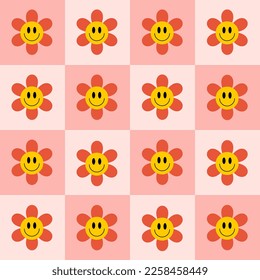 Retro checkerboard groovy seamless pattern with smiling flowers. Cute colorful trendy vector illustration in style 60s,70s. Pink, red and yellow colors