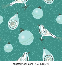 Retro Christmas ornaments seamless pattern in powder blue, teal and white.  Perfect for gift wrapping paper, tree skirts and holiday cards. Vintage glass decorations including clip on bird. Vector.