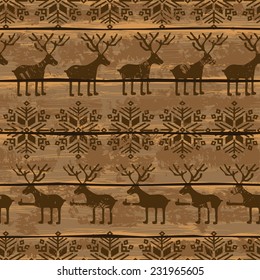 Retro Christmas seamless pattern with funny deers and snowflakes on a wooden boards background