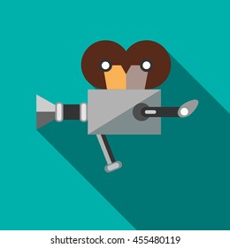 Retro cinema camera icon in flat style on a turquoise background