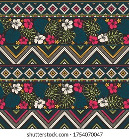 retro color tribal vector seamless pattern with hibiscus flowers and palm leaves. abstract geometric art print. ethnic vector background. Cloth design, fabric, cotton, textile template, tissue