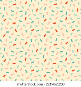 Retro confetti sprinkles seamless pattern on cream background. Pastel party seamless pattern in pastel pink, blue and red. Abstract party celebration background.