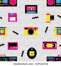 Retro devices seamless pattern. Memphis design. 80s - 90s fashion style. Record player, videotape, audiocassette, photo camera, pager, floppy disk