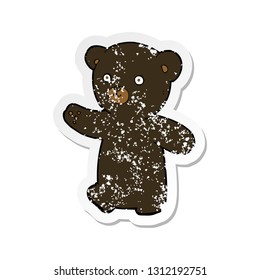 retro distressed sticker of a cartoon black bear cub